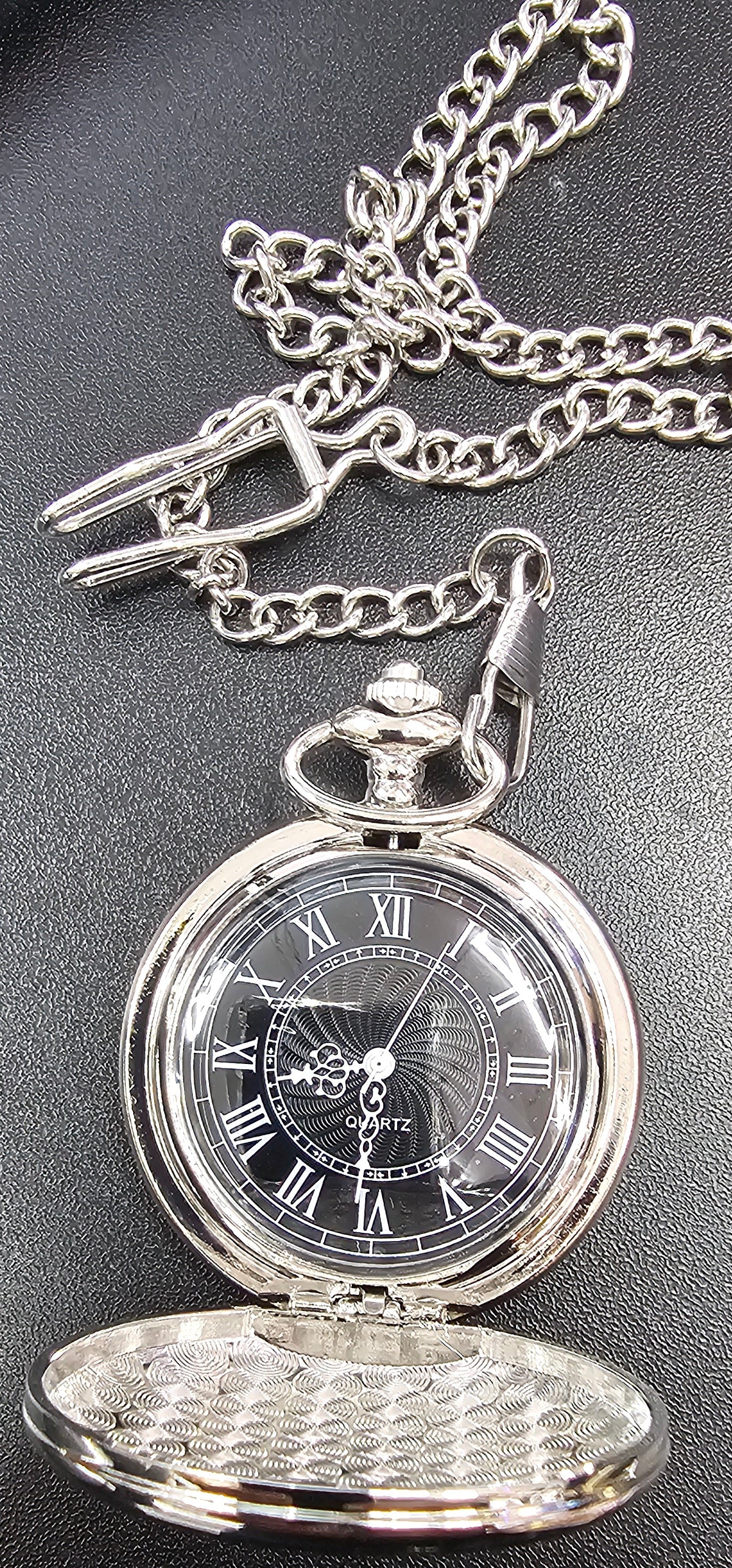 Pocket watch with chain on a dark surface